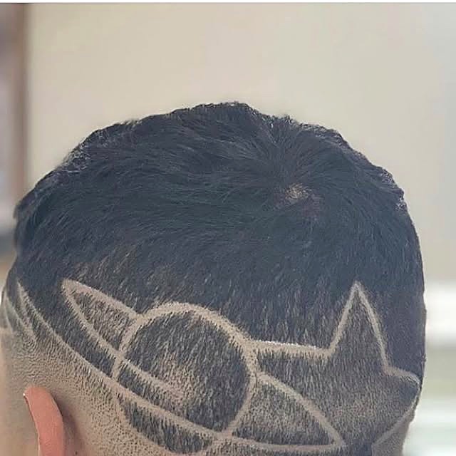 Client's custom star design cut at Tato's Barbershop