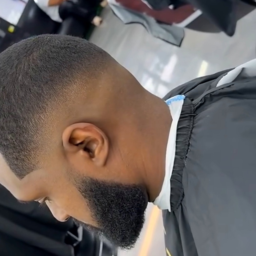 Client's clean fade and shaped beard at Tato's Barbershop