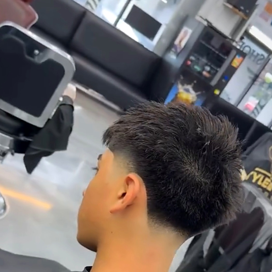 Young client's taper fade at Tato's Barbershop